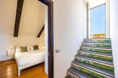 Letto o letti in una camera di Un Terrazzo Panoramico su Napoli by Wonderful Italy