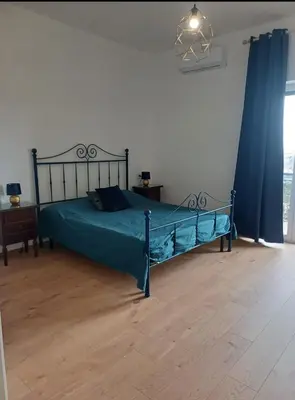 Letto o letti in una camera di Vesuvio&Partenope