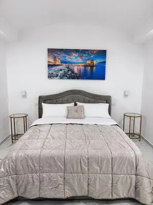 Letto o letti in una camera di Domus Napoli Museo