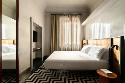Letto o letti in una camera di Unicum Suite Grande Archivio Napoli Centro Storico