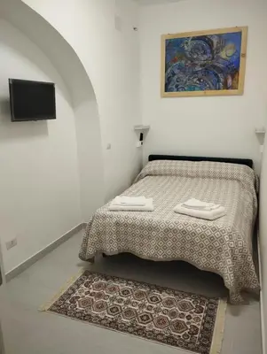 Letto o letti in una camera di Casa Vittoria