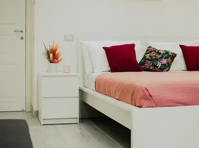 Letto o letti in una camera di casa vacanze Anema sweet