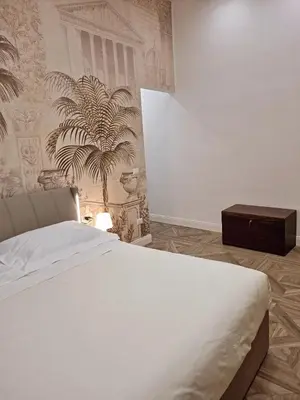 Letto o letti in una camera di Relais Santa Lucia sul Mare, Napoli