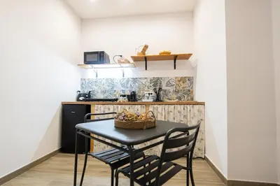 Cucina o angolo cottura di La casa di Bianca - modern suites near Plebiscito