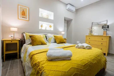 Letto o letti in una camera di La casa di Bianca - modern suites near Plebiscito