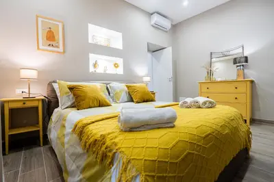 Letto o letti in una camera di La casa di Bianca - modern suites near Plebiscito