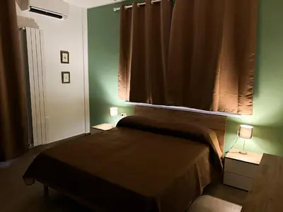 Letto o letti in una camera di Casa Momi Mergellina