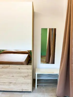 Letto o letti in una camera di Casa Momi Mergellina