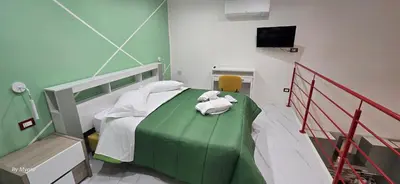 Letto o letti in una camera di Appartamenti La Dimora di Parthenope a Pontenuovo