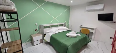Letto o letti in una camera di Appartamenti La Dimora di Parthenope a Pontenuovo