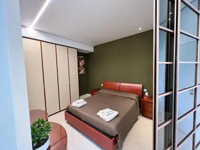 Letto o letti in una camera di Casa Leaf