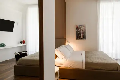 Letto o letti in una camera di The Napolitaner - Duomo Suite