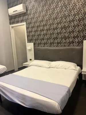 Letto o letti in una camera di International Hotels