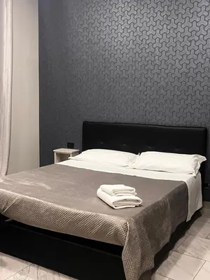 Letto o letti in una camera di International Hotels