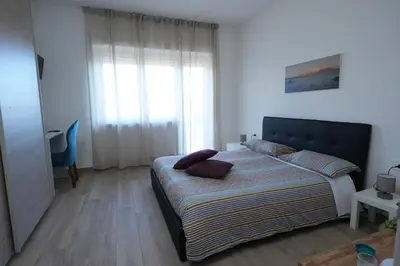 Letto o letti in una camera di Panorama Vesuvius Affittacamere Guesthouse with Lift near to Subway in Napoli Center