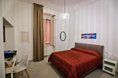 Letto o letti in una camera di Dante & Serenella station