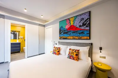 Letto o letti in una camera di Pop House in the Heart of Sanità by Wonderful Italy