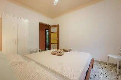 Letto o letti in una camera di Casa Spaziosa, a pochi passi da Metro e Centro