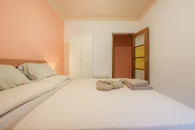 Letto o letti in una camera di Casa Spaziosa, a pochi passi da Metro e Centro
