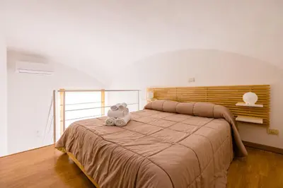 Letto o letti in una camera di Materdei Beautiful Terrace by NapoliApartments