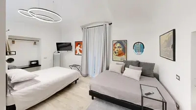 Letto o letti in una camera di NapArt Suites - My Place