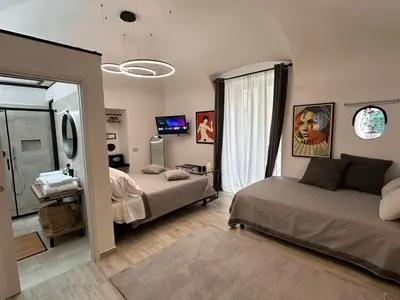 Letto o letti in una camera di NapArt Suites - My Place