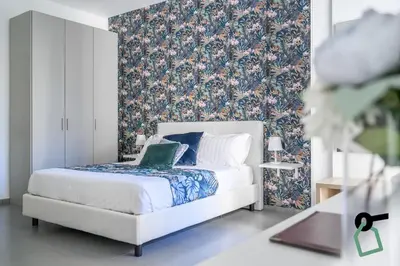 Letto o letti in una camera di HOTIDAY Room Collection - Napoli Duomo