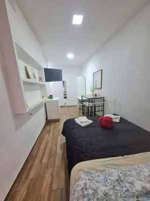 Letto o letti in una camera di Nexus House