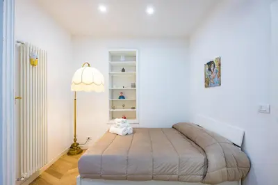 Letto o letti in una camera di Palazzo Loffredo by NapoliApartments
