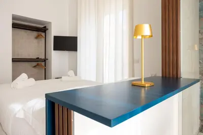 Letto o letti in una camera di Palazzo Pepe
