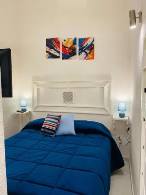 Letto o letti in una camera di I Rifugi Blu e Sole di Neapolis Teatro Antico