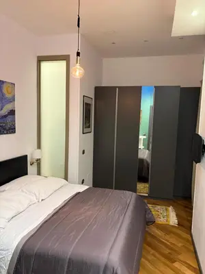 Letto o letti in una camera di Cucciola Arlecchino