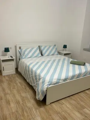 Letto o letti in una camera di Napoli centro le Suite di Giordy e Peppe