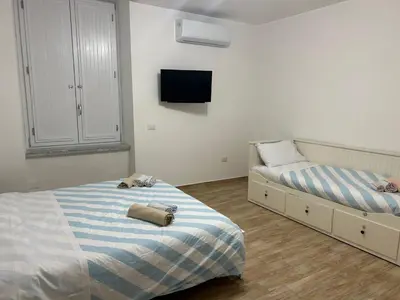Letto o letti in una camera di Napoli centro le Suite di Giordy e Peppe
