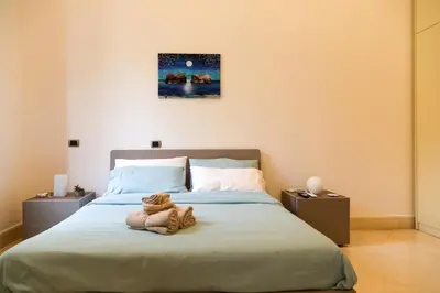 Letto o letti in una camera di Exclusive Apartment Five minutes from the Sea