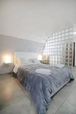 Letto o letti in una camera di Casa Sant Anna