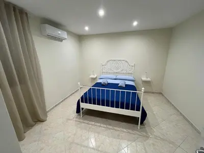 Letto o letti in una camera di La casa di Napoli
