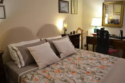 Letto o letti in una camera di Casa Chiaia Suor Orsola