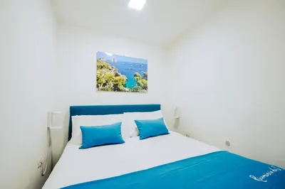 Letto o letti in una camera di Ricomincio da 3 Apartment Capri Centro Storico