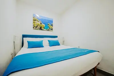 Letto o letti in una camera di Ricomincio da 3 Apartment Capri Centro Storico