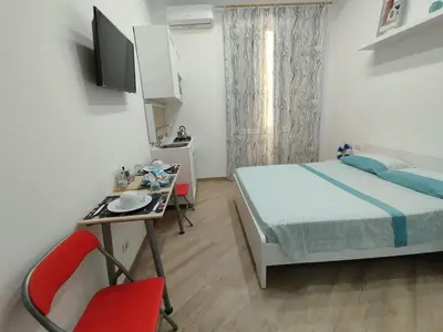 Letto o letti in una camera di Stanza centrale