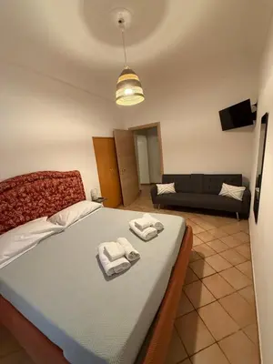 Letto o letti in una camera di Casa GiGi Napoli