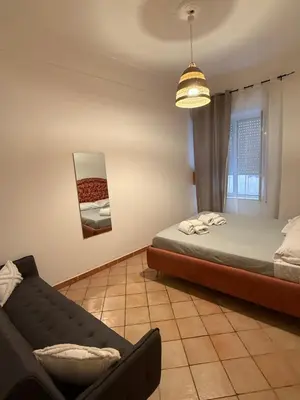 Letto o letti in una camera di Casa GiGi Napoli