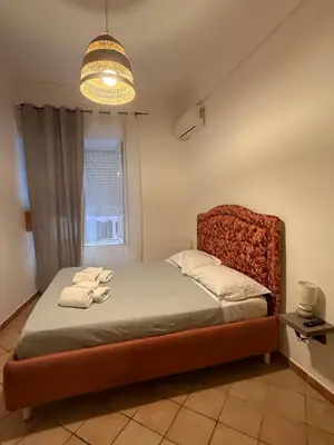 Letto o letti in una camera di Casa GiGi Napoli