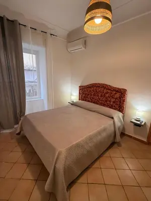 Letto o letti in una camera di Casa GiGi Napoli