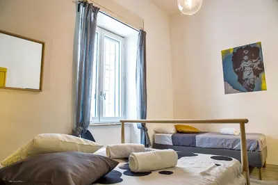 Letto o letti in una camera di Napoli Connect Guesthouse