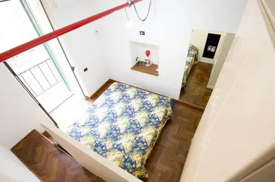 Letto o letti in una camera di Bella Sorella Suite Napoli
