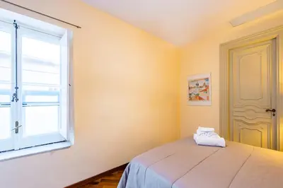 Letto o letti in una camera di Bisignano 11