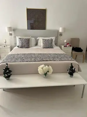 Letto o letti in una camera di Relais Piazza dei Martiri