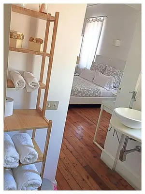 Letto o letti in una camera di Relais Piazza dei Martiri